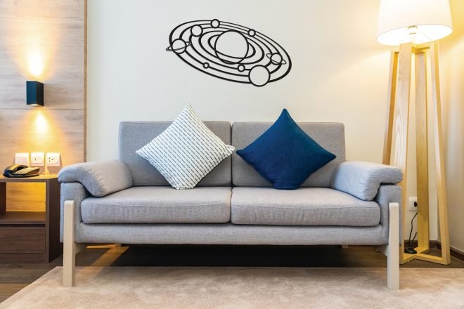 Comfortable pillow on sofa decoration with light lamp interior